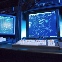 An ERAM controller workstation with radar displays and a specialized keyboard